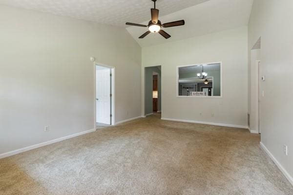 4841 Partee Trl, Social Circle, GA 30025 - carpeted spare room with a ceiling fan, baseboards, and high vaulted ceiling