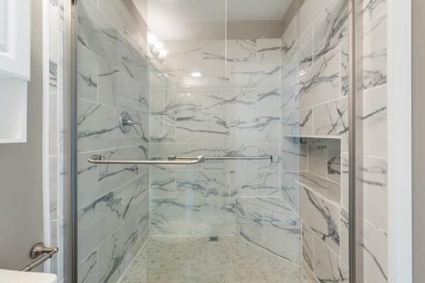 4841 Partee Trl, Social Circle, GA 30025 - bathroom featuring a marble finish shower