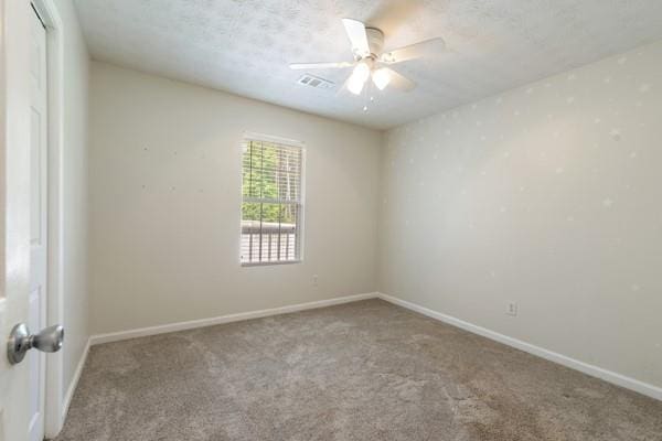 4841 Partee Trl, Social Circle, GA 30025 - carpeted empty room with a ceiling fan and baseboards
