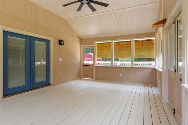 4841 Partee Trl, Social Circle, GA 30025 - unfurnished sunroom with french doors, hardwood / wood-style flooring, vaulted ceiling, wood walls, and a deck