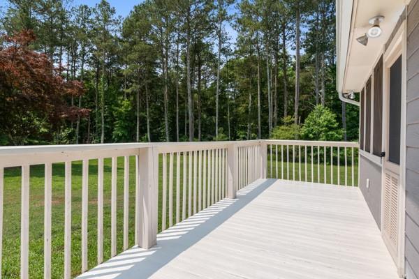 4841 Partee Trl, Social Circle, GA 30025 - wooden terrace featuring a lawn