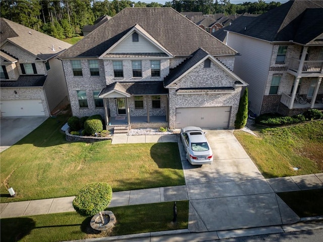 view of front of home featuring a garage and a front lawn