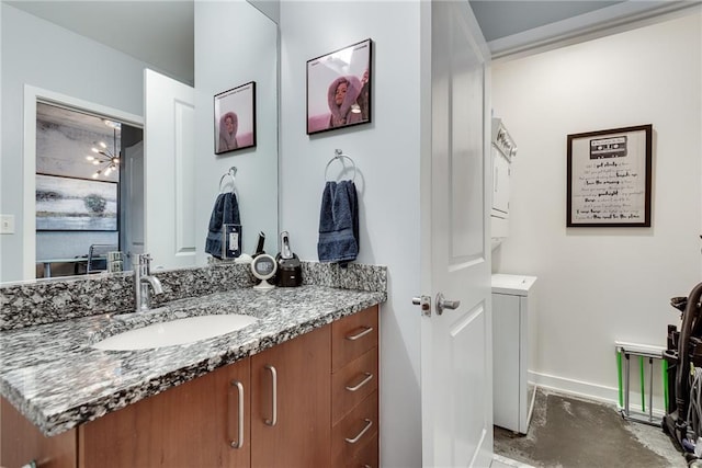 bathroom featuring baseboards and vanity