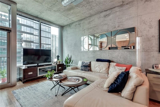 living area with a wealth of natural light and wood finished floors