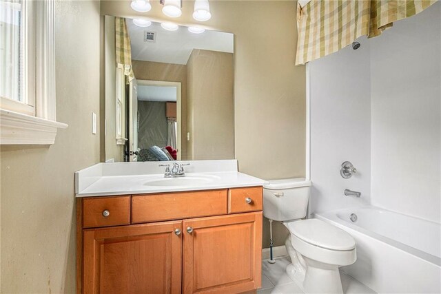 full bath featuring vanity, visible vents, toilet, tile patterned floors, and baseboards