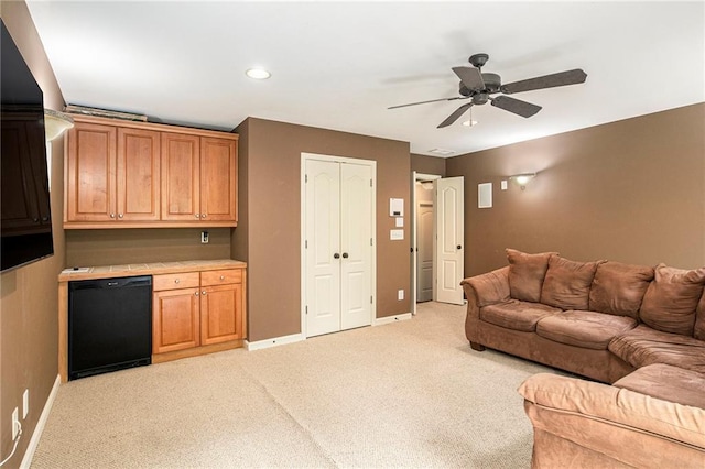 living area with light colored carpet, baseboards, a ceiling fan, and recessed lighting