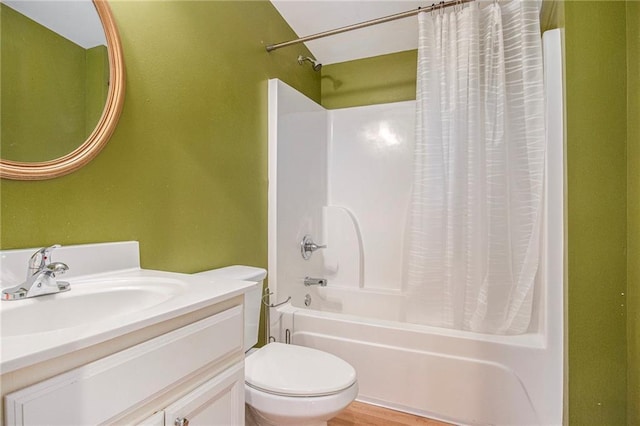 full bathroom featuring shower / bath combo, vanity, and toilet