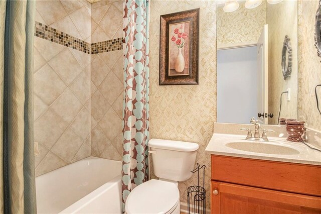 bathroom featuring wallpapered walls, toilet, vanity, and shower / bath combination with curtain