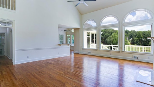 127 Grandmar Chase, Canton, GA 30115 - unfurnished living room with ceiling fan, high vaulted ceiling, and wood finished floors
