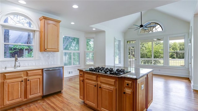 127 Grandmar Chase, Canton, GA 30115 - kitchen with dishwasher, black gas stovetop, light wood-type flooring, light stone counters, and ceiling fan