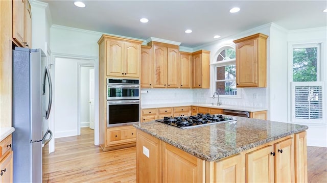 127 Grandmar Chase, Canton, GA 30115 - kitchen featuring stainless steel appliances, light brown cabinetry, plenty of natural light, light wood-type flooring, and recessed lighting