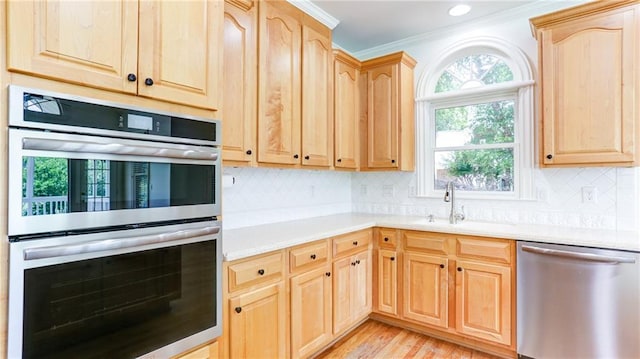 127 Grandmar Chase, Canton, GA 30115 - kitchen featuring appliances with stainless steel finishes, light brown cabinetry, and crown molding