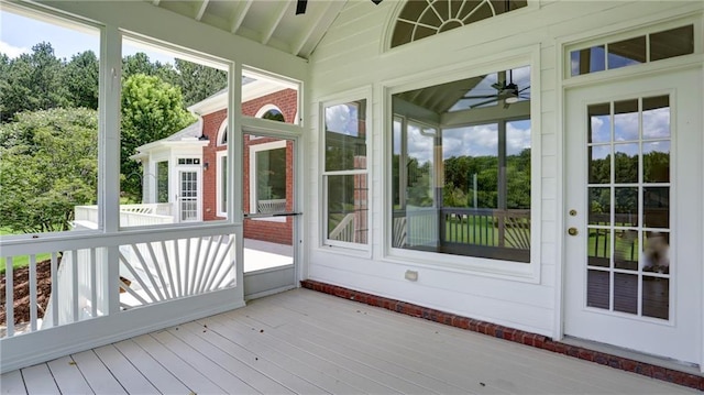 127 Grandmar Chase, Canton, GA 30115 - unfurnished sunroom with vaulted ceiling, a ceiling fan, and view of wooded area