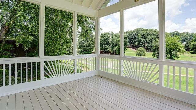 127 Grandmar Chase, Canton, GA 30115 - unfurnished sunroom with wood finished floors, view of scattered trees, a deck, and vaulted ceiling