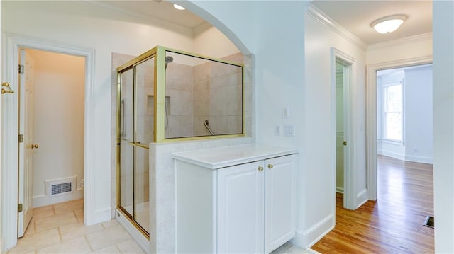 127 Grandmar Chase, Canton, GA 30115 - full bathroom featuring crown molding, a shower stall, wood finished floors, and vanity