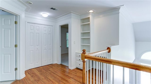 127 Grandmar Chase, Canton, GA 30115 - corridor featuring an upstairs landing, light wood-style flooring, built in shelves, and crown molding
