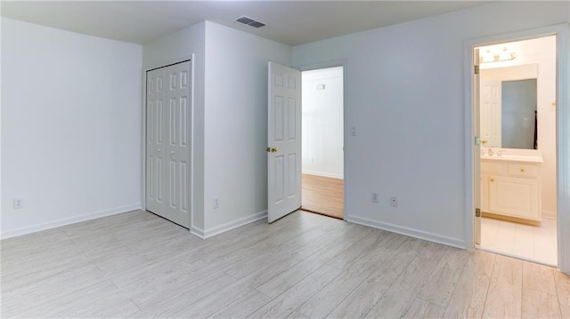 127 Grandmar Chase, Canton, GA 30115 - unfurnished bedroom featuring light wood-style flooring, a closet, and ensuite bath