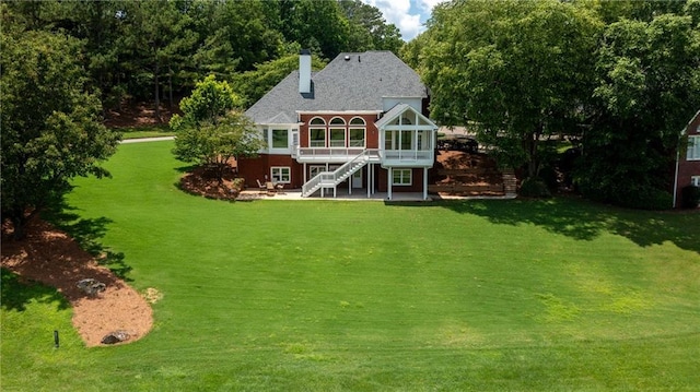 127 Grandmar Chase, Canton, GA 30115 - rear view of property featuring a sunroom, a chimney, a lawn, and stairway