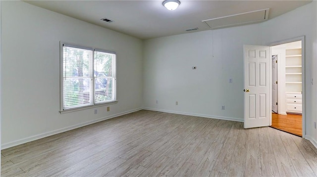 127 Grandmar Chase, Canton, GA 30115 - empty room featuring attic access and light wood-type flooring