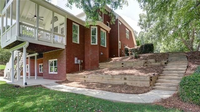 127 Grandmar Chase, Canton, GA 30115 - view of home's exterior with stairway, a ceiling fan, and brick siding