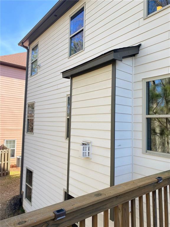 view of side of home with fence