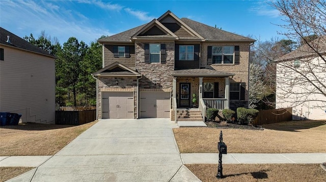 craftsman-style home featuring stone siding, a porch, an attached garage, and driveway