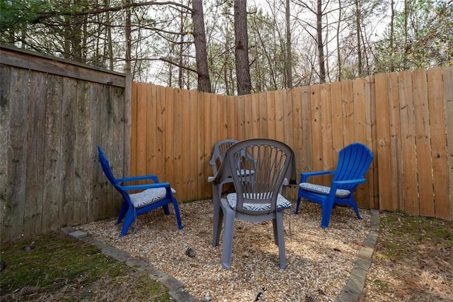 view of patio featuring fence