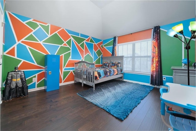 bedroom with wood finished floors and baseboards