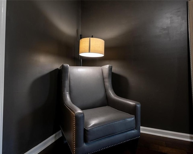 sitting room featuring baseboards and wood finished floors