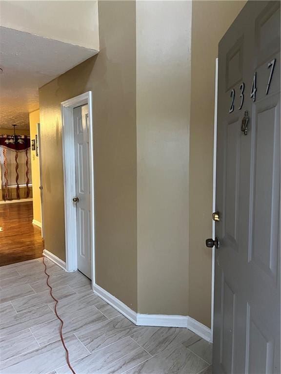 interior space featuring baseboards