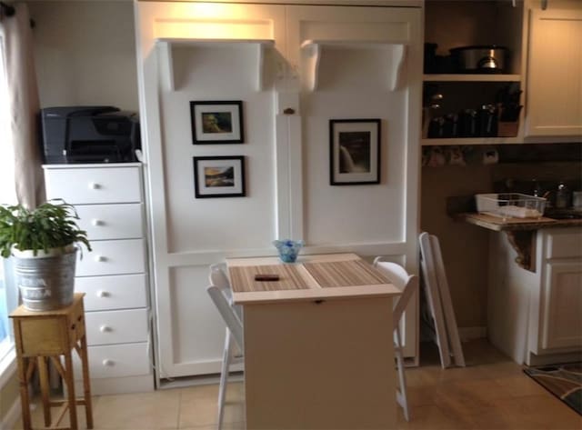 kitchen with light tile patterned floors