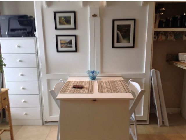 dining area featuring light tile patterned floors