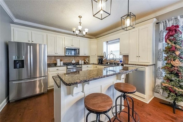 kitchen featuring dark wood-type flooring, white cabinetry, sink, and stainless steel appliances