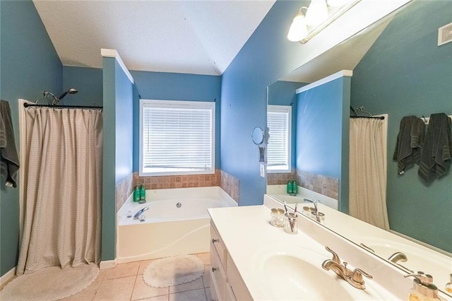 bathroom with tile patterned flooring, a bathtub, lofted ceiling, and vanity