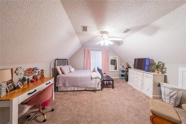 bedroom featuring lofted ceiling, ceiling fan, light colored carpet, and a textured ceiling