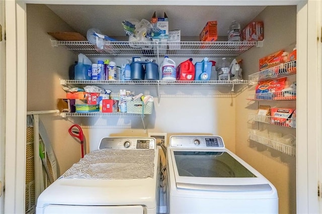 washroom with washing machine and clothes dryer