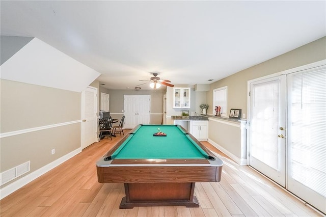 rec room featuring ceiling fan, light hardwood / wood-style floors, billiards, and a wealth of natural light