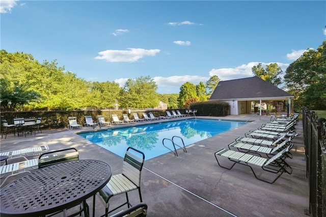 view of pool featuring a patio area