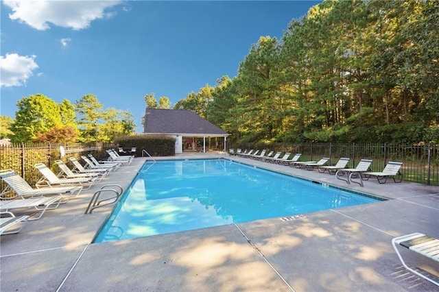 view of swimming pool featuring a patio area