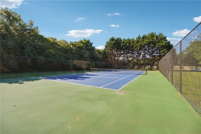 view of sport court with basketball hoop