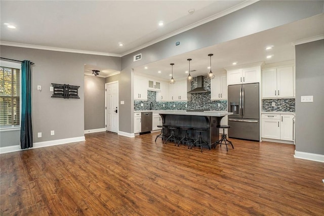 708 Mcgill Pl NE, Atlanta, GA 30312 - kitchen with wall chimney exhaust hood, stainless steel fridge with ice dispenser, range with two ovens, a breakfast bar, and decorative backsplash