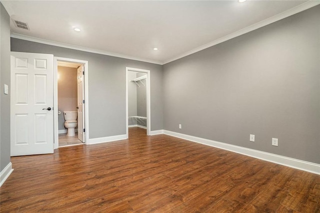 708 Mcgill Pl NE, Atlanta, GA 30312 - unfurnished bedroom featuring crown molding, baseboards, a spacious closet, wood finished floors, and recessed lighting