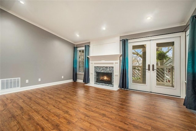 708 Mcgill Pl NE, Atlanta, GA 30312 - unfurnished living room with wood finished floors, baseboards, french doors, crown molding, and a fireplace
