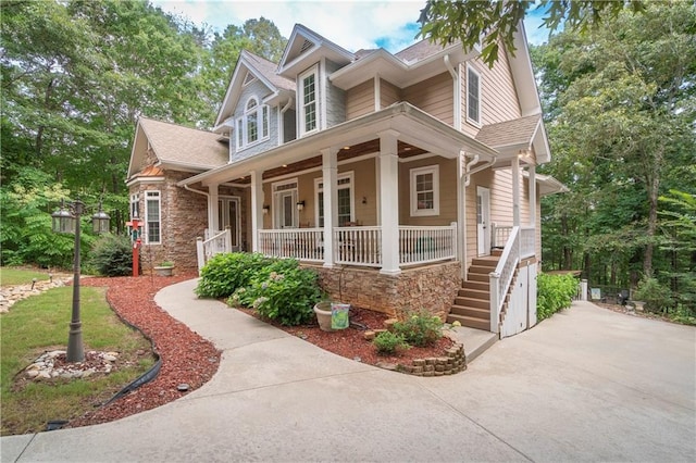 view of front of house featuring a porch and a garage