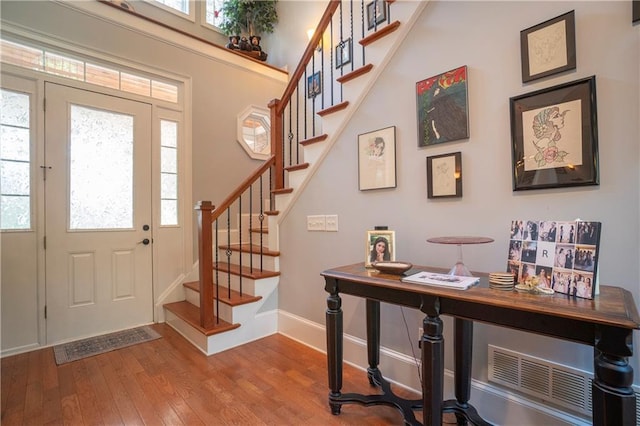 foyer entrance featuring light wood-type flooring and plenty of natural light