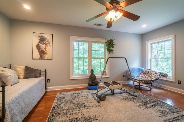 sitting room with ceiling fan and dark hardwood / wood-style flooring