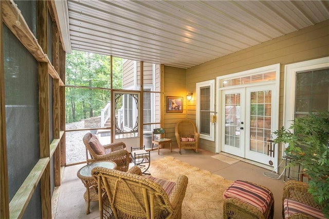 sunroom / solarium with french doors and a healthy amount of sunlight