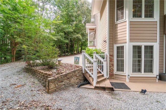 view of property exterior with a patio area