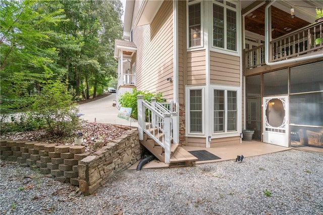 view of property exterior featuring a patio area