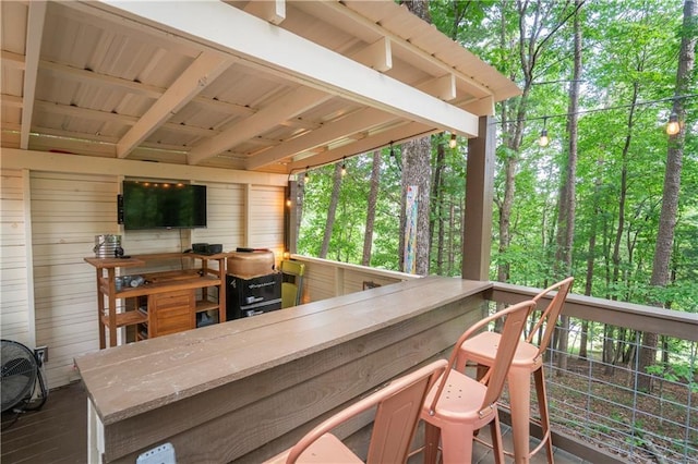 wooden deck featuring an outdoor bar